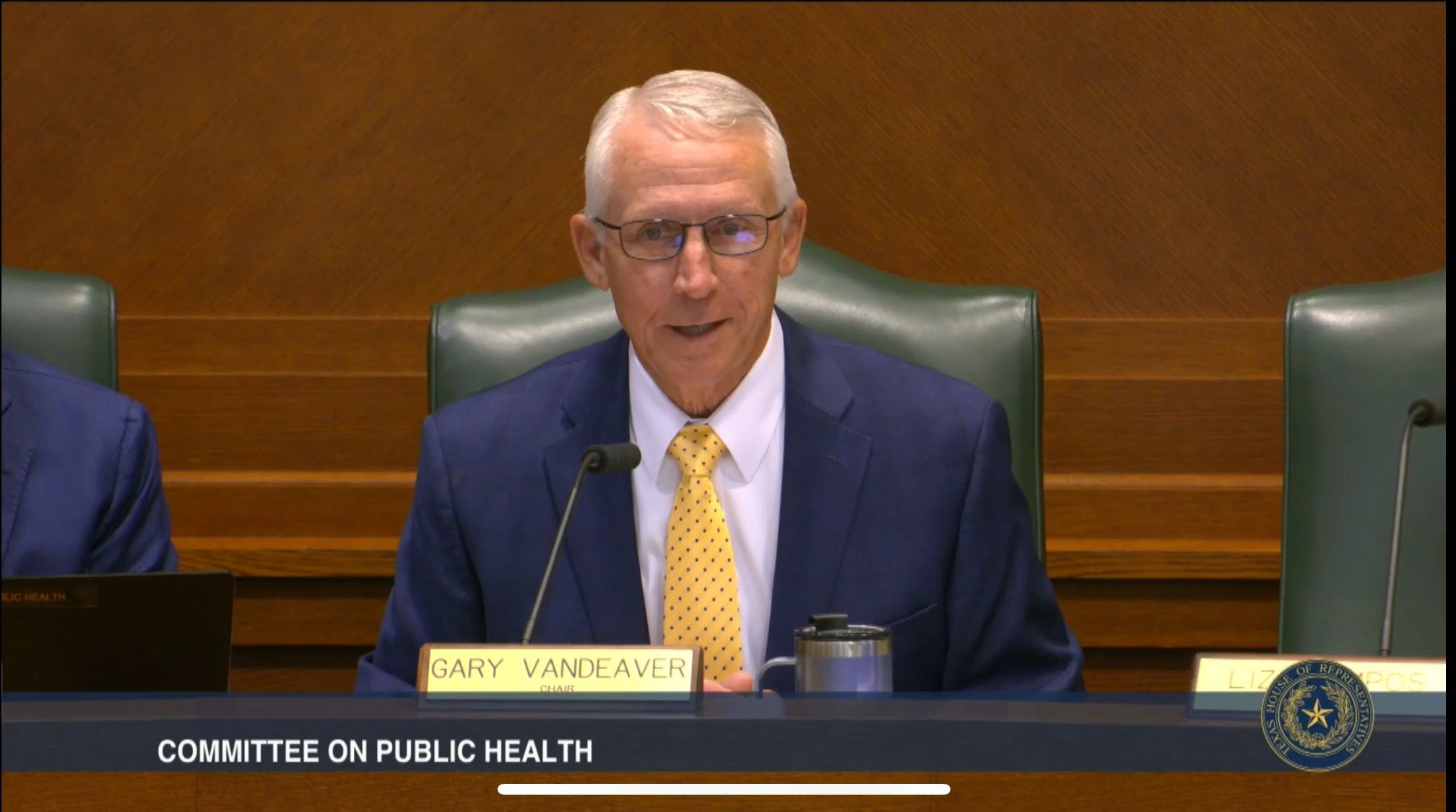Video still of Rep. Gary VanDeaver chairing the House Committee on Public Health hearing
