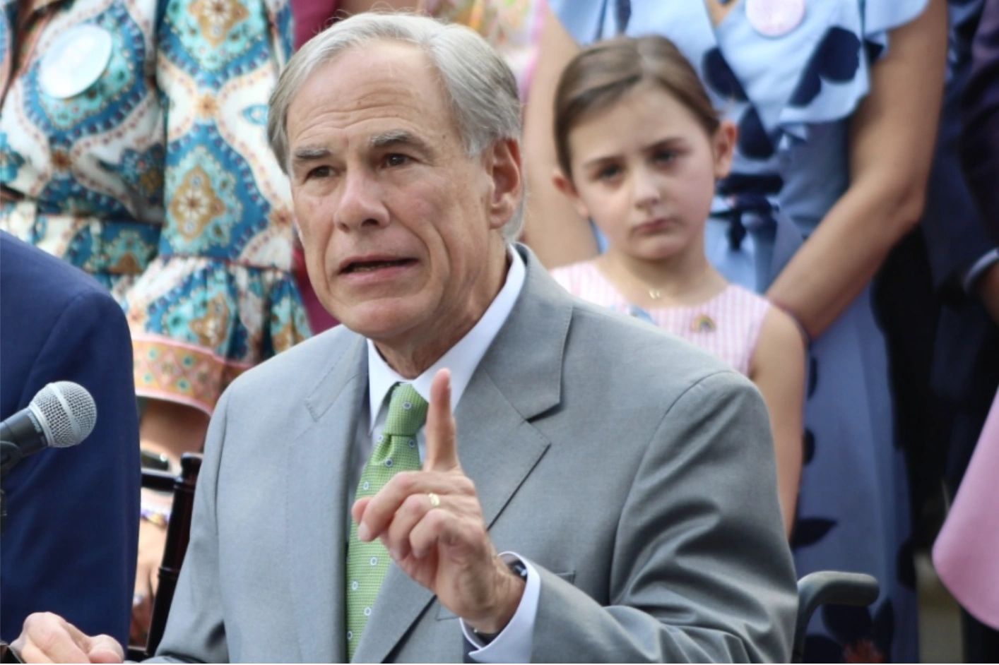 Gov. Greg Abbott speaking at a podium
