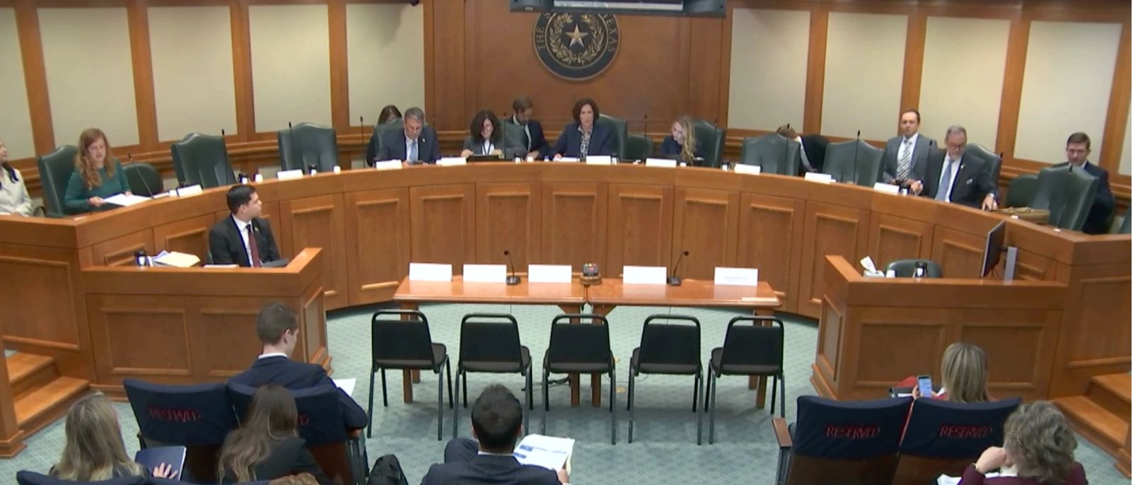 Video still of a Texas Senate committee seated at the dais in a Capitol hearing room